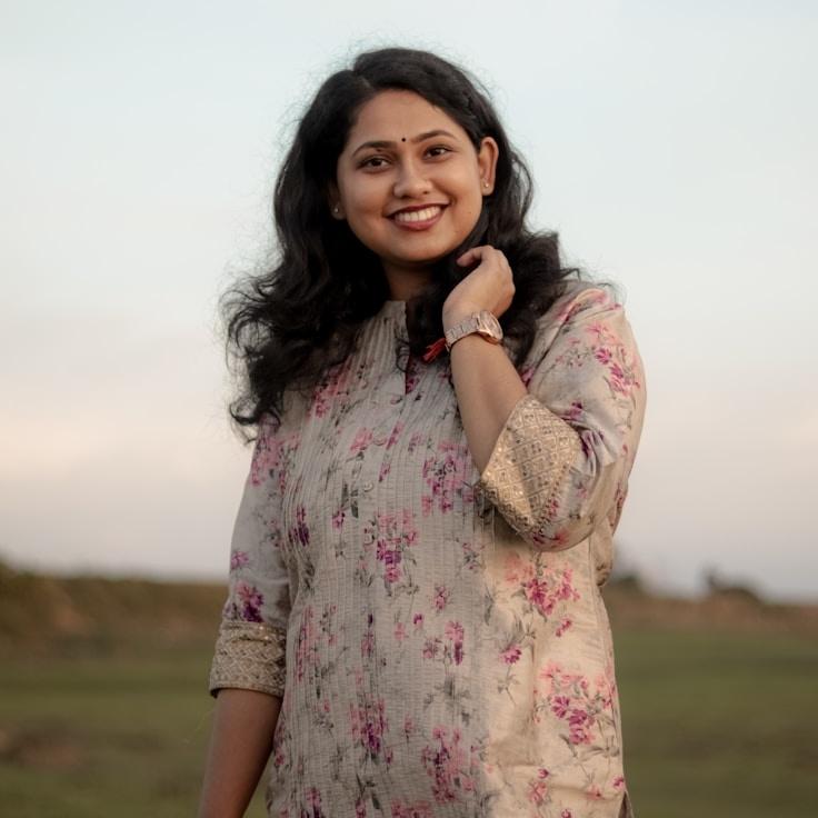 Aria Desai, Client Relations Director, discussing corporate gifting strategy with business clients